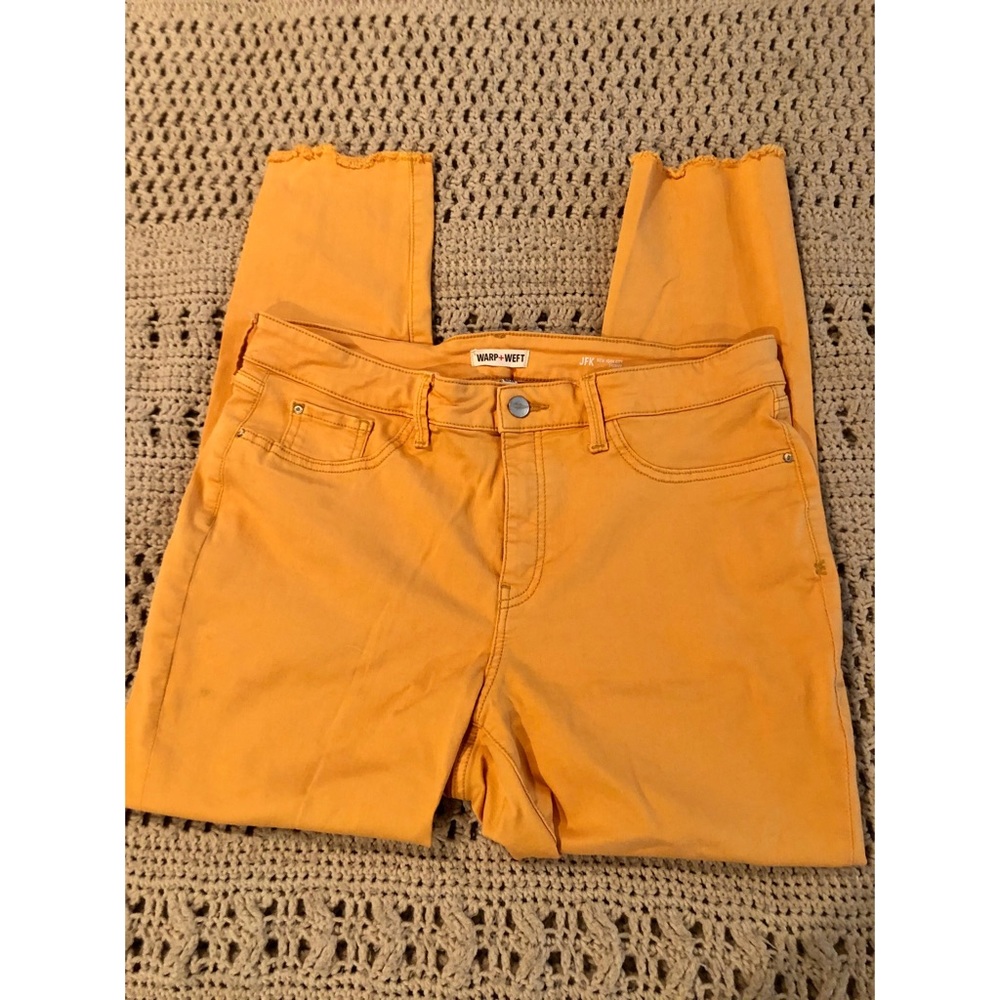 Stretchy mustard skinnies with a frayed edge